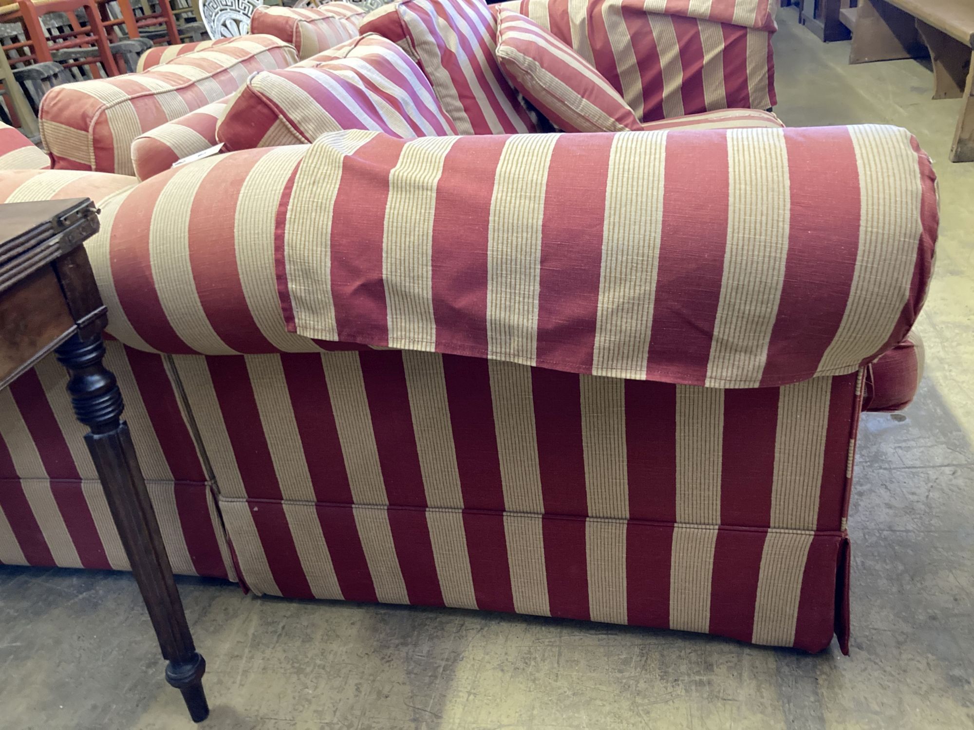 A pair of modern Chesterfied settees with red and cream upholstery (upholstery worn), length 178cm, depth 100cm, height 72cm